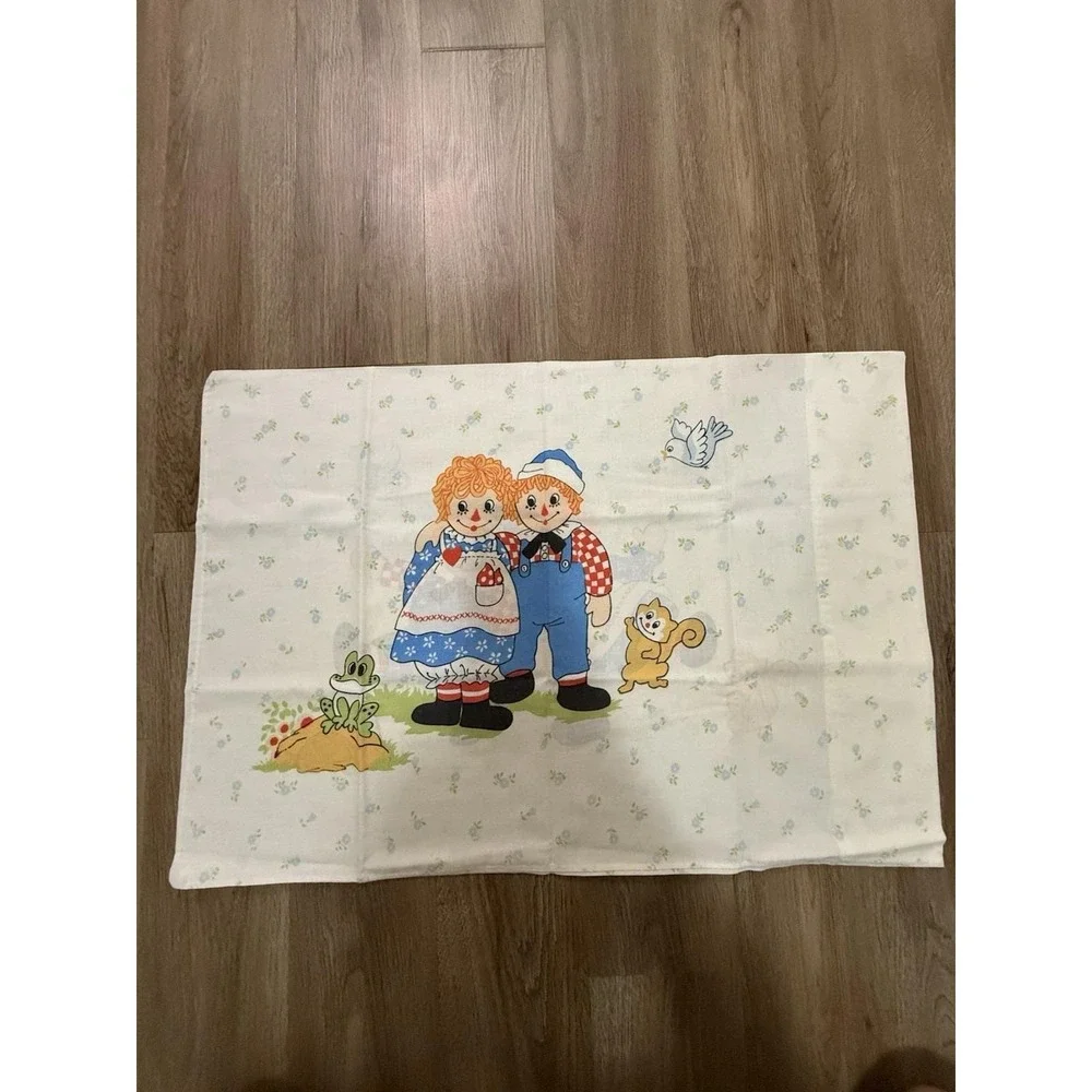 Vintage sheet and pillowcase featuring Raggedy Ann and Andy